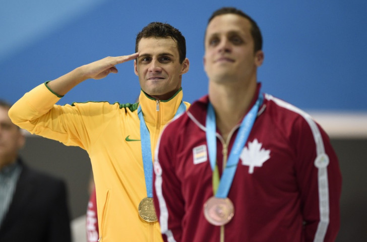 Swimmer Leonardo De Deus saluting after being awarded his 200m butterfly gold medal ©AFP/Getty Images