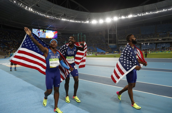 Mike Rodgers, Justin Gatlin and Tyson Gay celebrate their Olympic 4x100m bronze medal Rio 2016 before news of their disqualification came through as they were being interviewed on TV ©Getty Images