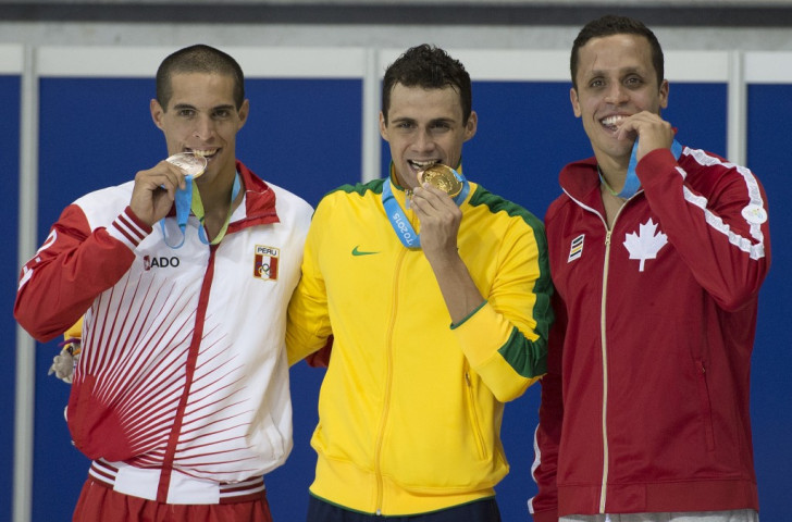 Mauricio Fiol (left) pictured celebrating his 200m butterfly silver medal which he is now set to be stripped of ©AFP/Getty Images