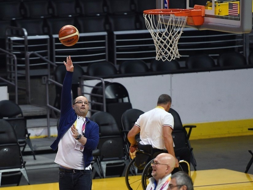 IOC Evaluation Commission chair and FIBA secretary general Patrick Baumann shows off his basketball skills ©Getty Images