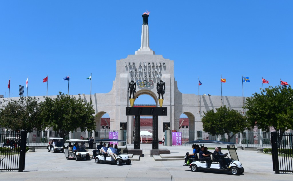 IOC Evaluation Commission depart the Los Angeles Memorial Coliseum on golf carts during their venue tour ©Getty Images