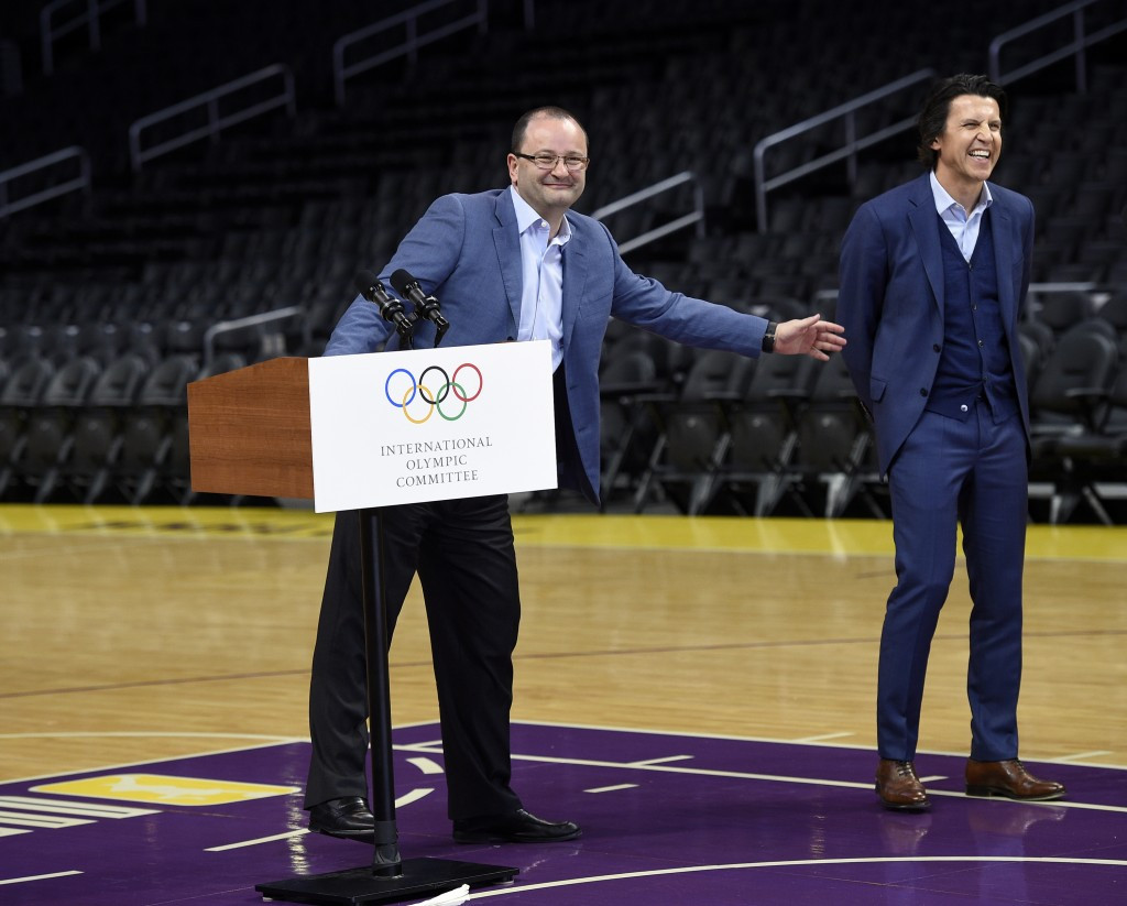 IOC Evaluation Commission chair Patrick Baumann, left, jokes with Olympic Games executive director Christophe Dubi ©Getty Images