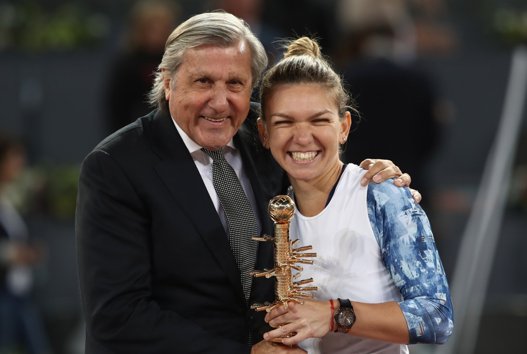 Ilie Nastase was part of the presentation party at the Madrid Open trophy ceremony as Romania's Fed Cup team member Simona Halep was crowned champion for a second year running ©Getty Images