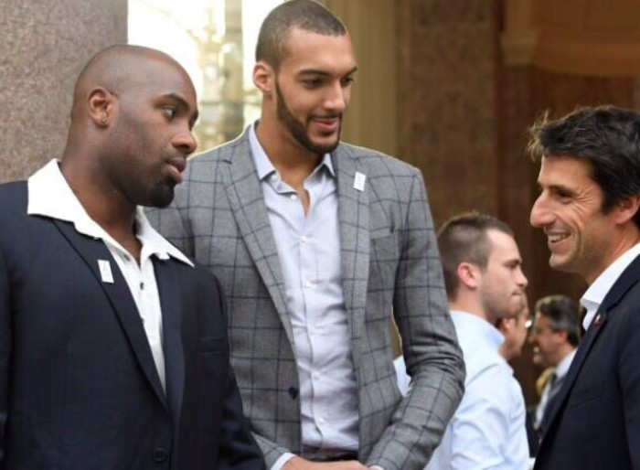 Judoka Teddy Riner, left, and basketball player Rudy Gobert, centre, tower over Paris 2024 co-bid leader Tony Estanguet at a special dinner hosted for the IOC Evaluation Commission ©Tony Estanguet/Twitter
