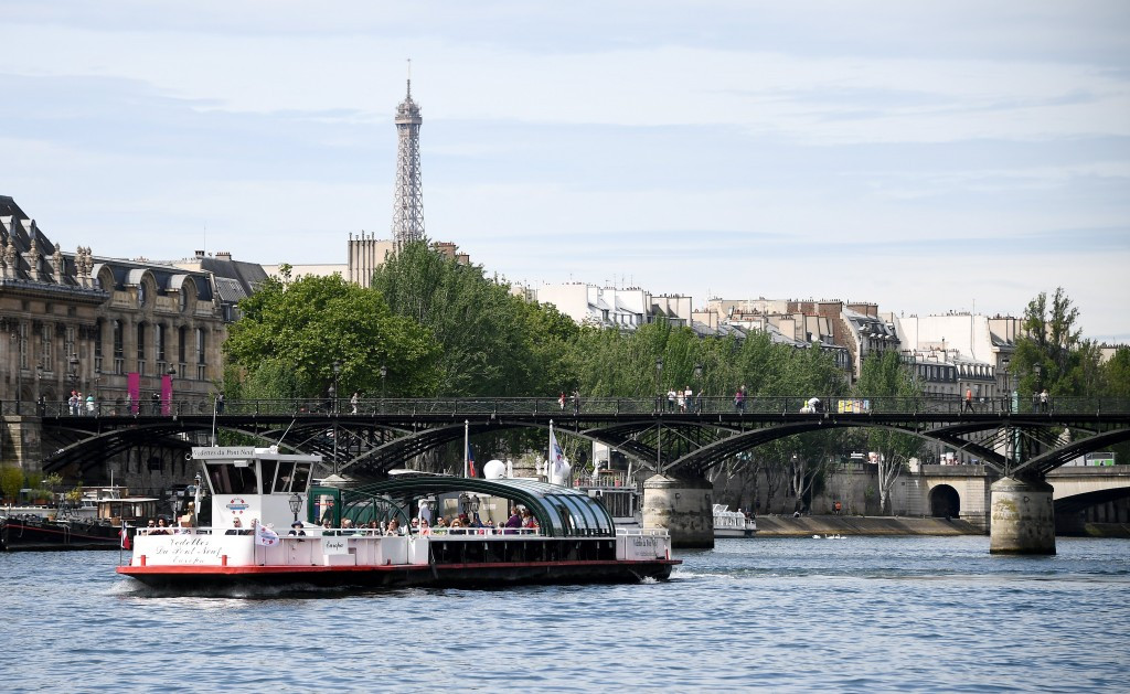IOC Evaluation Commission members travel in a boat down the River Seine on a day of venue tours ©Getty Images