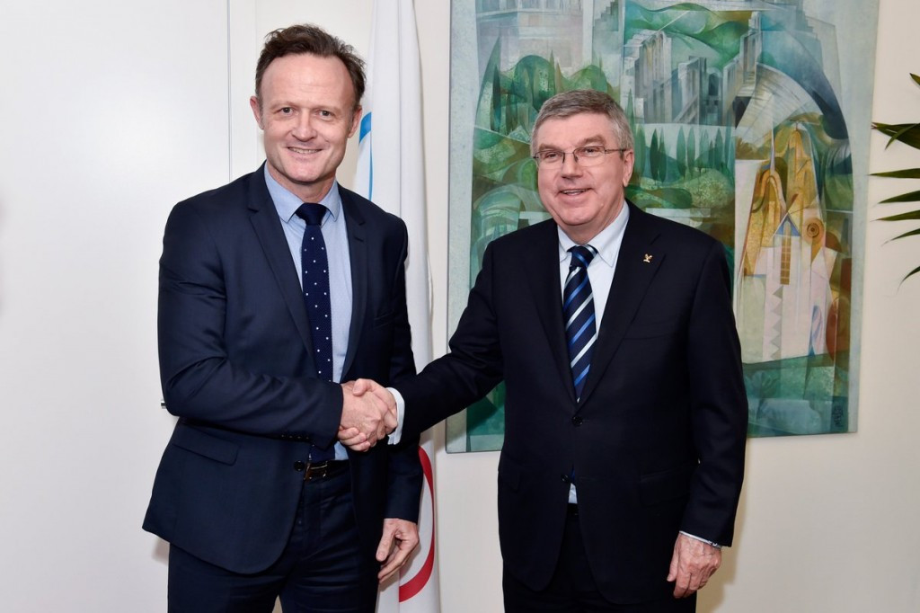 Laurent Petrynka, left, with IOC President Thomas Bach in Lausanne at their February meeting. They share a vision for future global school sport ©ISF