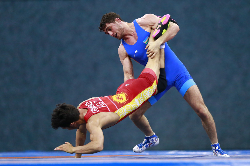 Haji Aliyev, blue, won one of two wrestling golds for Azerbaijan ©Getty Images