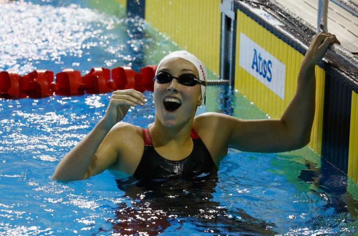 Redemption for Overholt as teenager secures stunning swimming gold at Toronto 2015