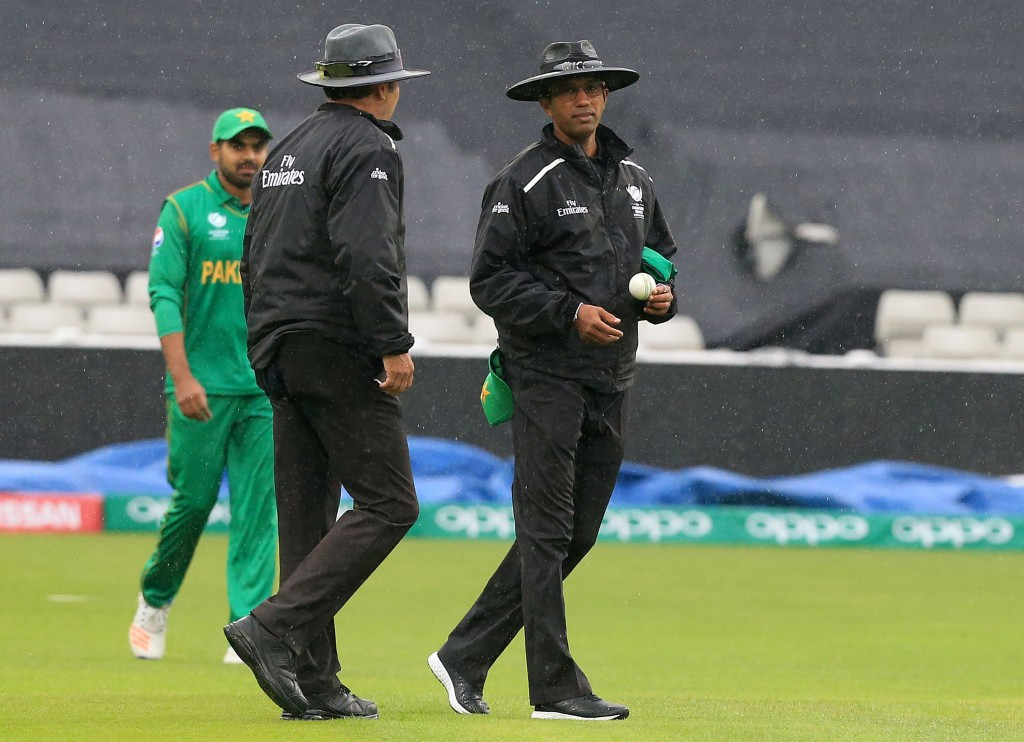 On-field umpires Kumar Dharmasena, right, and Richard Illingworth walking off after the rain returned to Edgbaston ©Getty Images