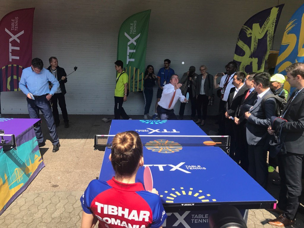 Thomas Bach playing table tennis during a visit to the ITTF World Championships today ©ITG