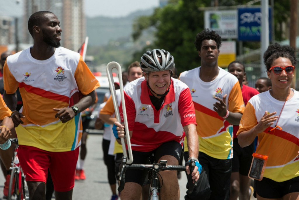 Roger Gibbon cycling with the Queen's Baton through Port of Spain ©Gold Coast 2018
