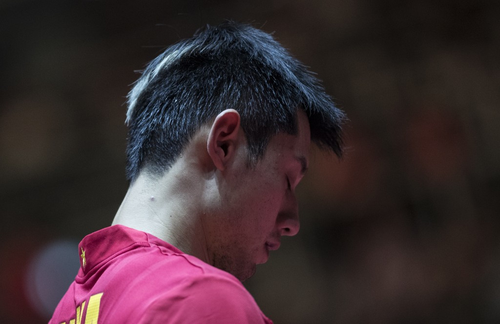Zhang Jike cuts a disconsolate figure after a shock defeat today in the third round ©Getty Images