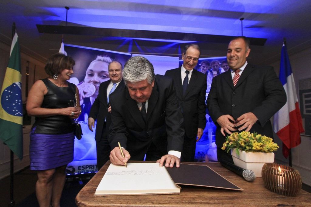 Denis Masseglia looks on as the contract is signed for France to have a hospitality house at the Sociedade Hípica Brasileira during Rio 2016 