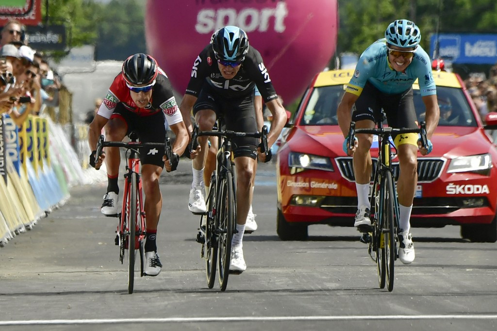 Jakob Fuglsang, right, won a sprint finish against Richie Porte, left, and Chris Froome, centre, ©Getty Images