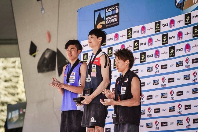 South Korea's Jongwon Chon, centre, moved closer to the top of the World Cup rankings with a win today ©IFSC
