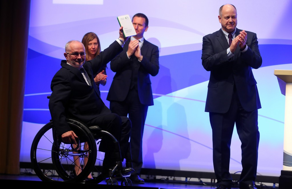 International Paralympic Committee President Sir Philip Craven shows off the special ceritificate presented to the governing body after winning the first-ever BP Courage Award in Berlin last year 