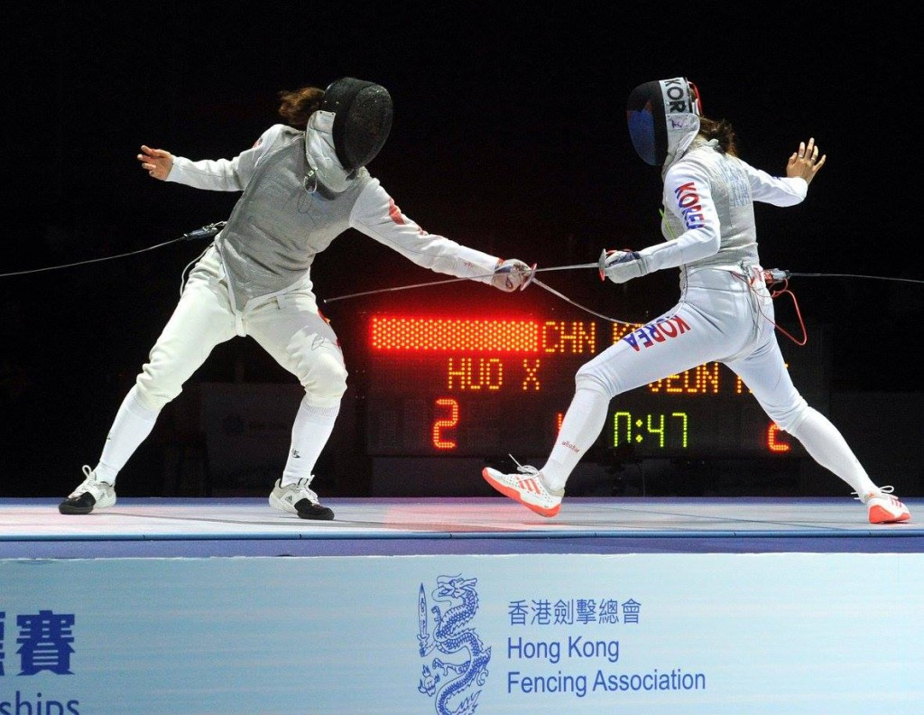Huo Xingxin, left, secured the women's individual foil gold medal in Hong Kong ©FIE/Facebook/Trifiletti/Bizzi