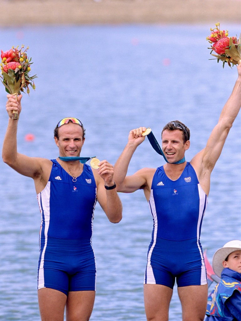 Michel Andrieux, left, and current FISA President Jean-Christophe Rolland of France after winning gold in the men's coxless pair at Sydney 2000 ©Getty Images