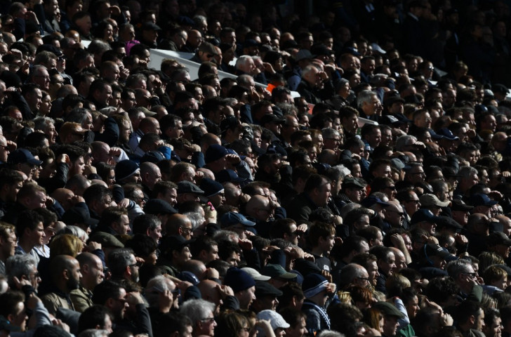 Tottenham fans at the recent home game against Southampton shield their eyes from the sun and remain patiently in the stand despite the ball going out of play frequently ©Getty Images
