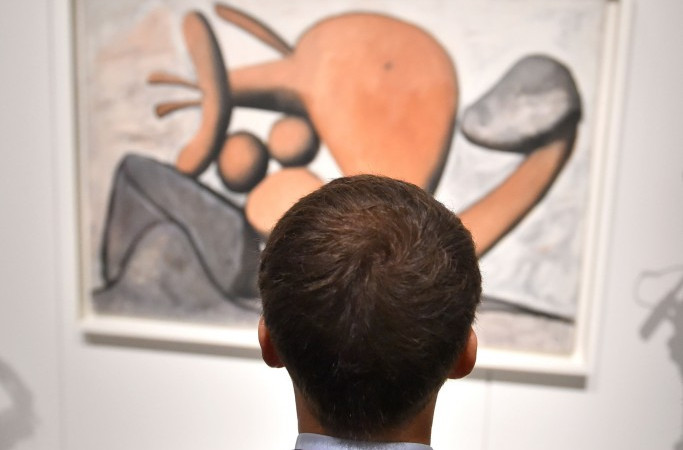 French President Emmanuel Macron views a Picasso picture at the Soulages Museum in southern France. Were he a football administrator rather than a politician he would be reflecting on the disappointing amount of canvas left uncovered ©Getty Images