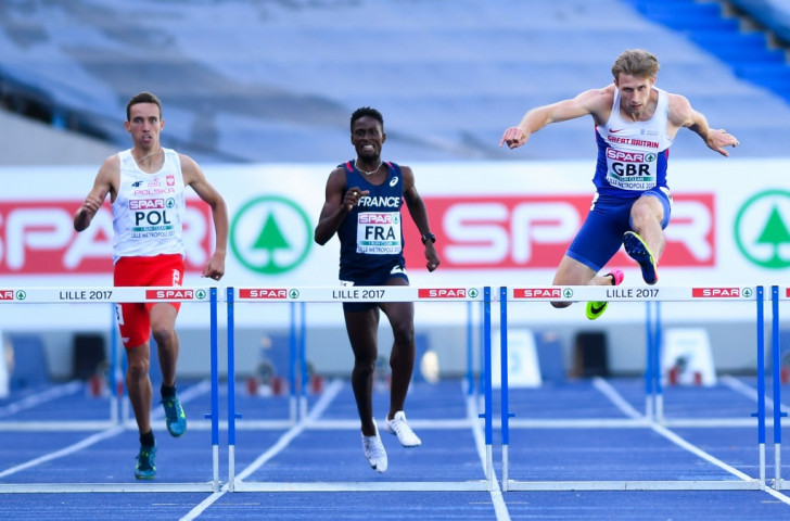 Britain's Jack Green, right, en route to the fastest 400m hurdles qualifying time on the opening day of the European Athletics Team Championships in Lille ©Getty Images