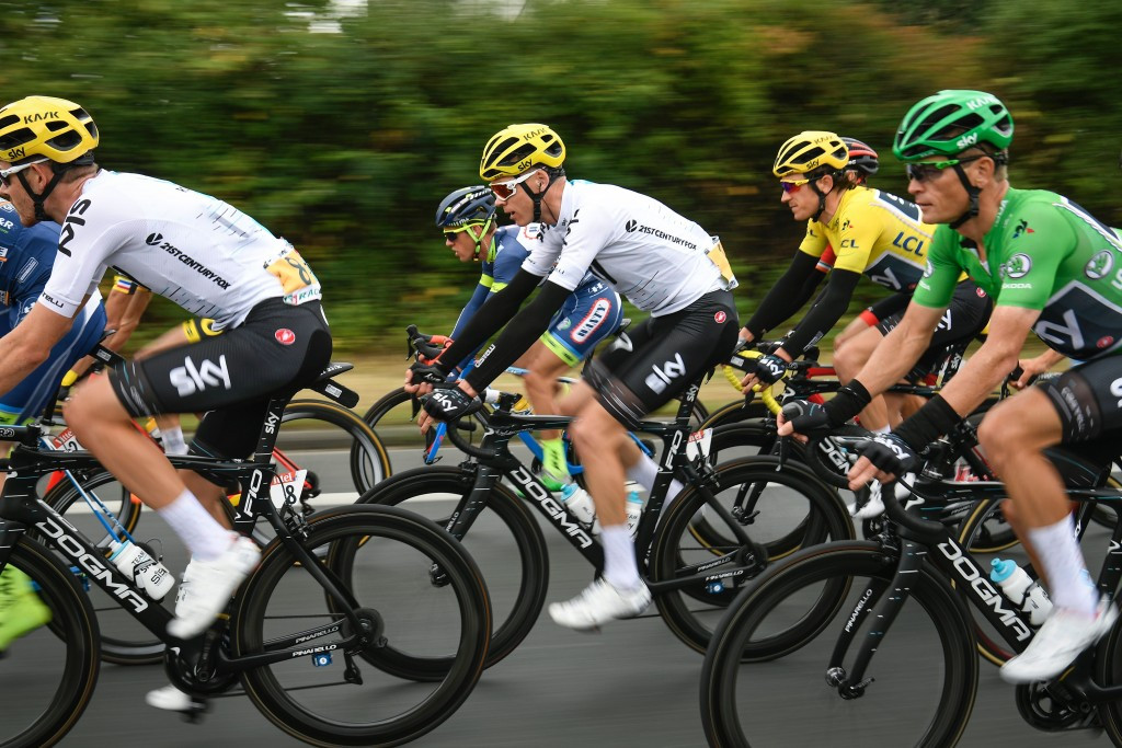 Defending champion Chris Froome, centre, crashed in the wet conditions around 30km from the finish ©Getty Images