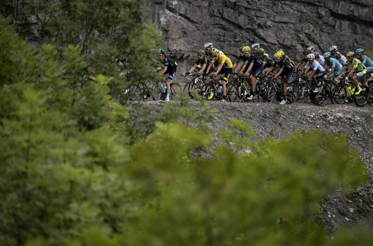 Chris Froome fended off attacks to maintain his lead after the first Alpine stage