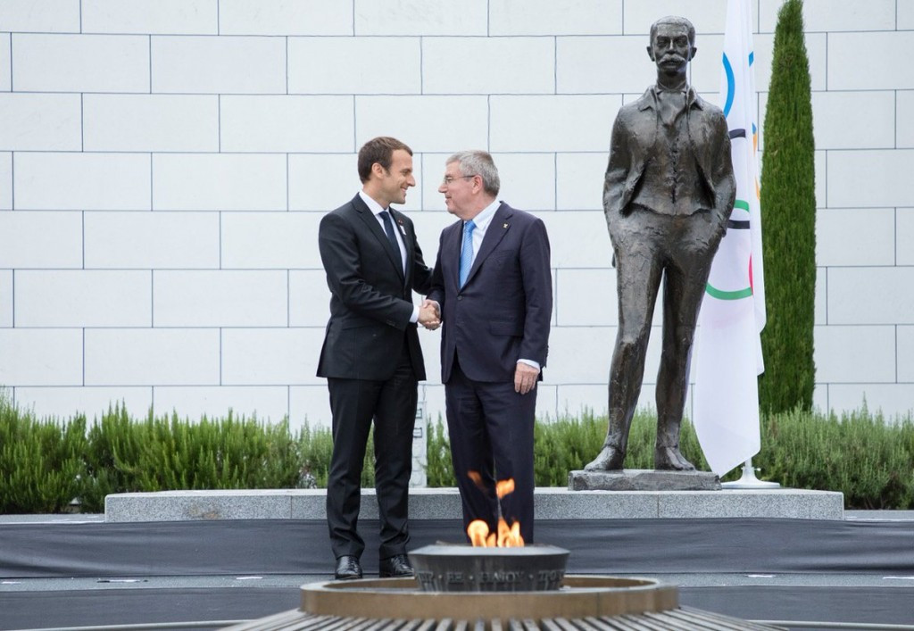 Macron meets Bach in rain at Olympic Museum 