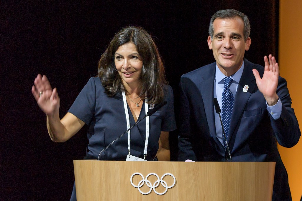 Anne Hidalgo, left, and Eric Garcetti collectively thank the IOC for their joint-awarding approval ©Getty Images