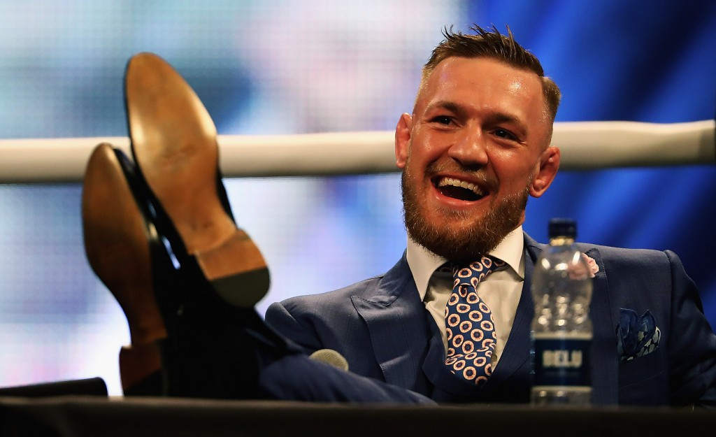 Conor McGregor laughs during the media tour stop at Wembley Arena for his fight with Floyd Mayweather Jnr ©Getty Images