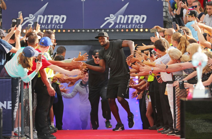 The world and Olympic 100m and 200m champion enjoys the vibe as he leads out the Bolt All-Stars team in the Nitro Athletics event ©Getty Images