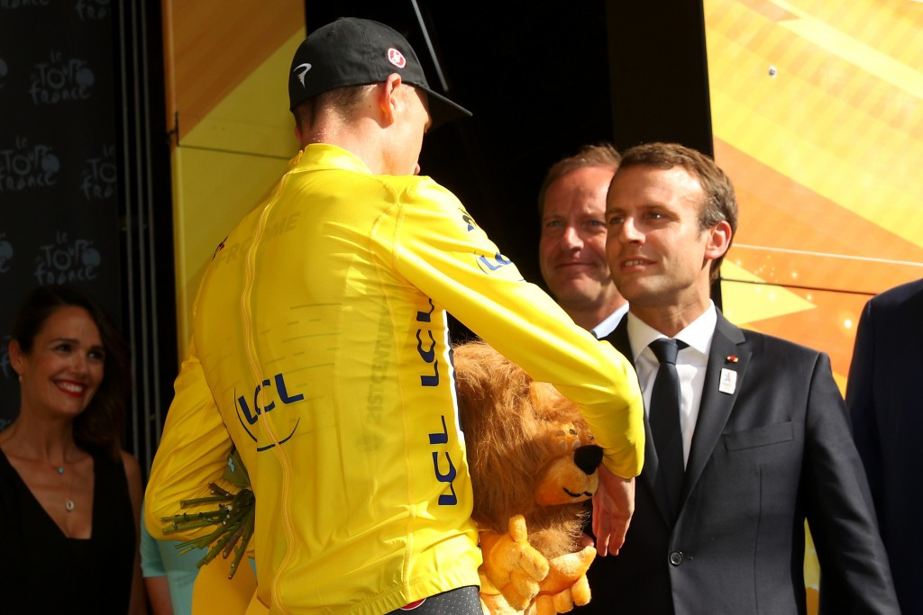 French President Emmanuel Macron presented Chris Froome with his yellow jersey as he tightened his control on the Tour de France ©Getty Images