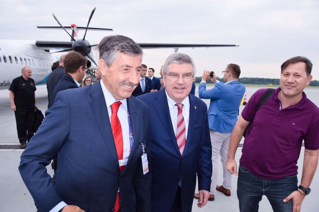 IWGA President José Perurena López, left, greeted Thomas Bach, centre, at Wrocław airport ©IWGA