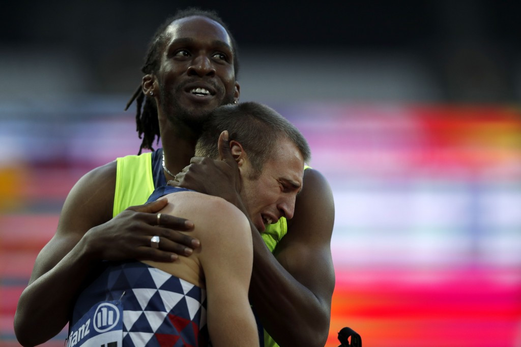 France's Timothée Adolphe is consoled by guide Yannick Fonsat after being disqualified in the men's 200m T11 ©Getty Images
