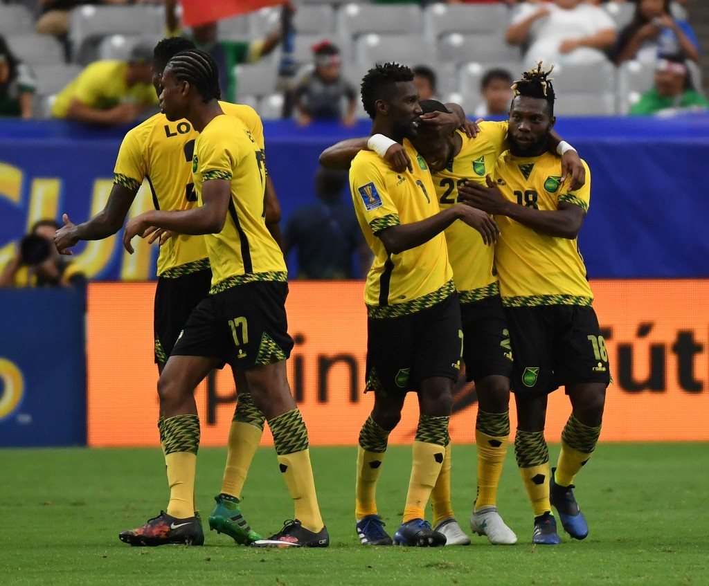Jamaican players celebrate Romario Williams' winner in their 2-1 victory against Canada ©Getty Images
