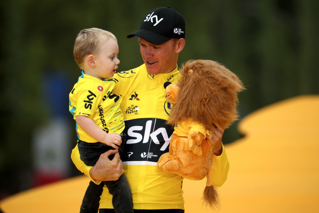 Chris Froome celebrates his latest Tour de France success with his son Kellan in Paris on Sunday ©Getty Images