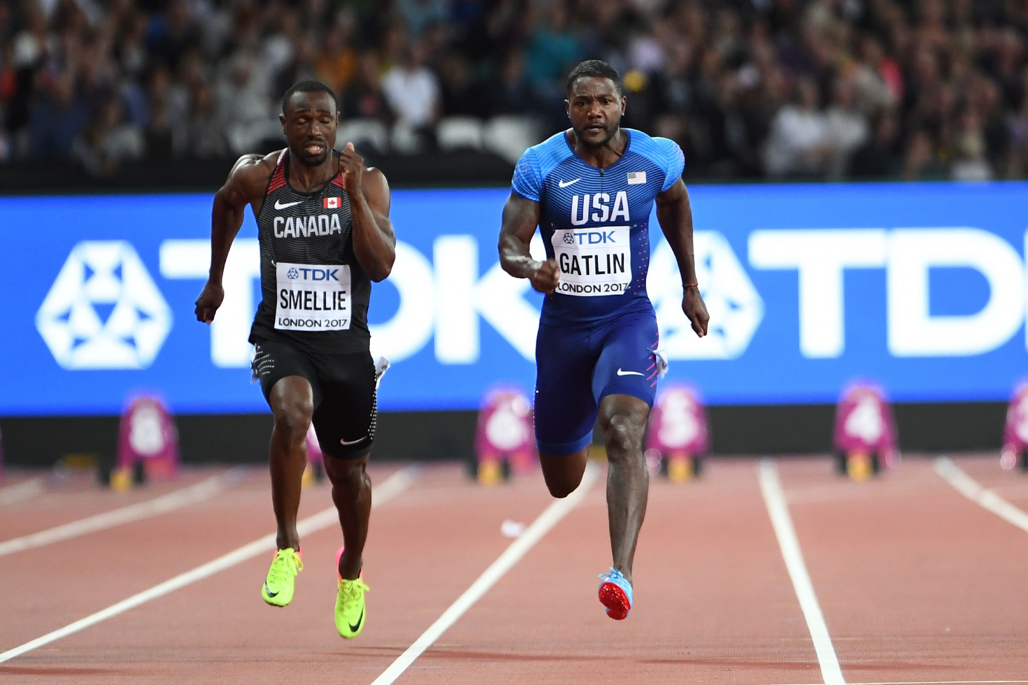Justin Gatlin, right, was booed by the crowd before winning his 100m heat ©Getty Images