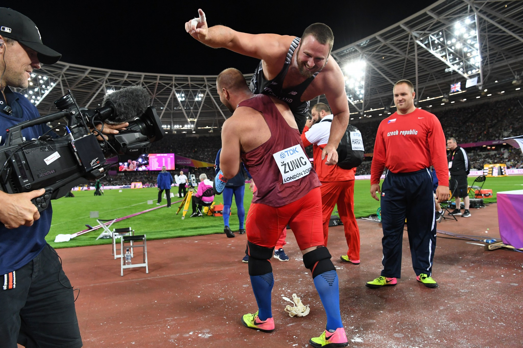 Tomas Walsh is lifted high after winning the shot put title ©Getty Images