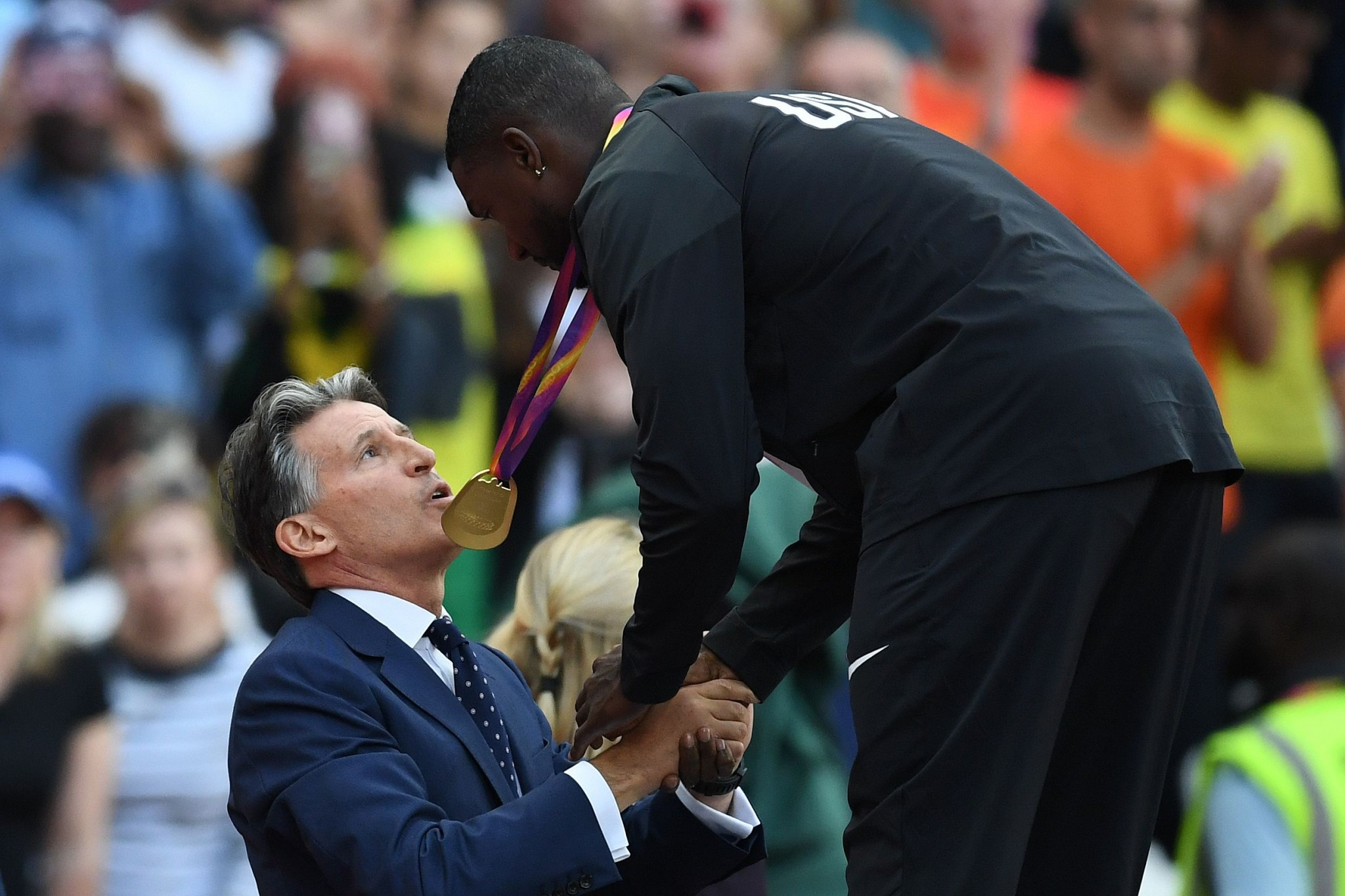 Justin Gatlin received his gold medal from IAAF President Sebastian Coe ©Getty Images