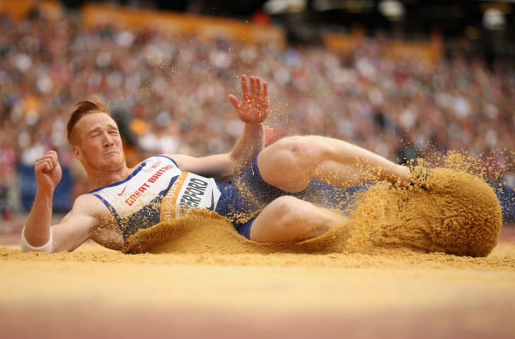 Britain's Olympic long jump champion Greg Rutherford lands in the sand during last weekend's Sainsbury's Anniversary Games in the Olympic Stadium. Soon he will have his own backyard sandpit sorted out and certified ©Getty Images