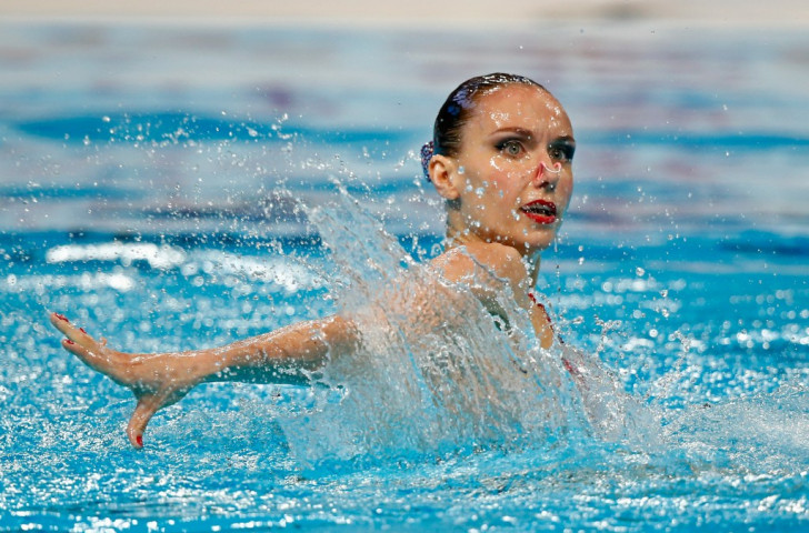 Russia's Natalia Ishchenko now has 18 world titles to her name after success in the synchronised swimming solo free event