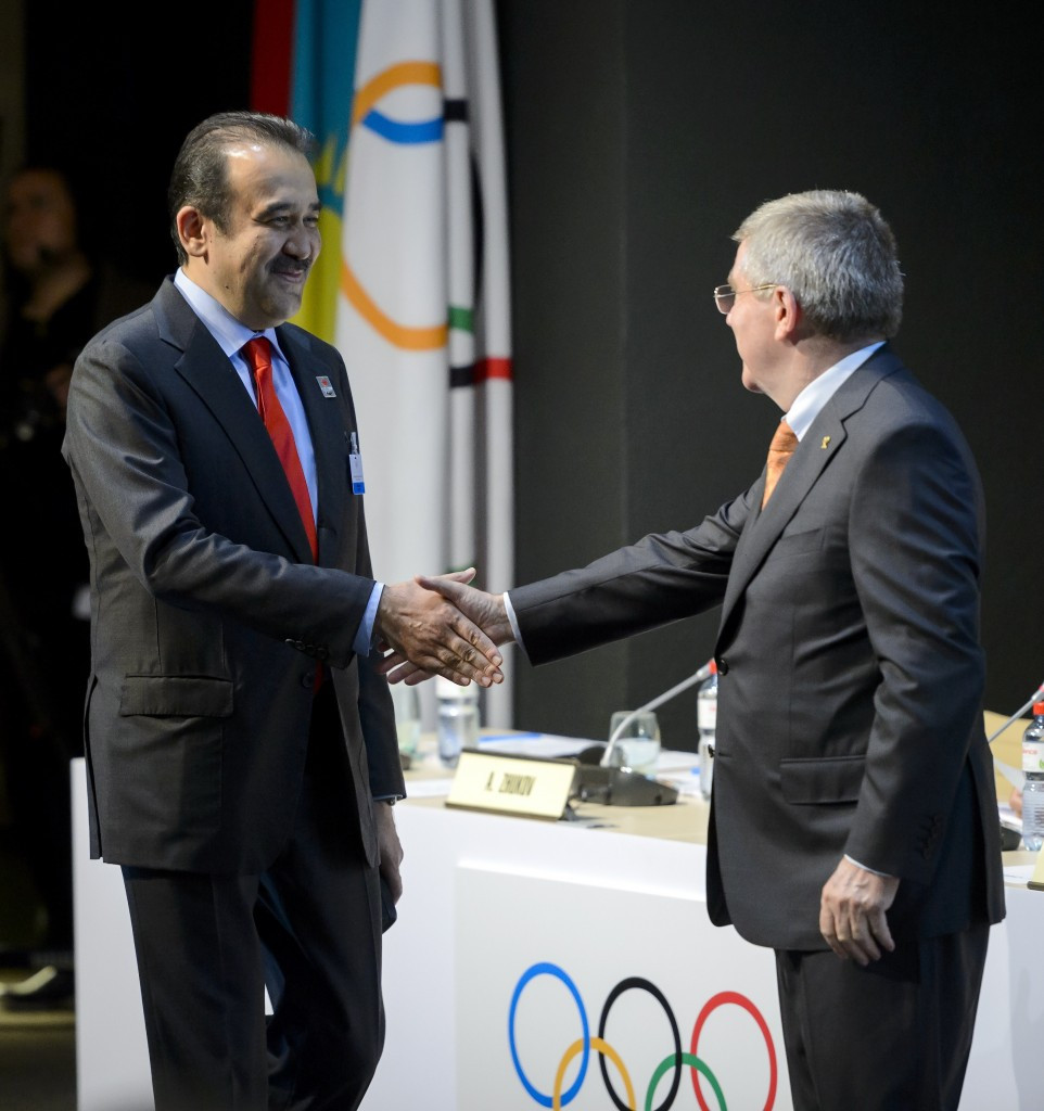 Karim Massimov (left), pictured with IOC President Thomas Bach last month, insists the bid will be unaffected by economic problems ©AFP/Getty Images