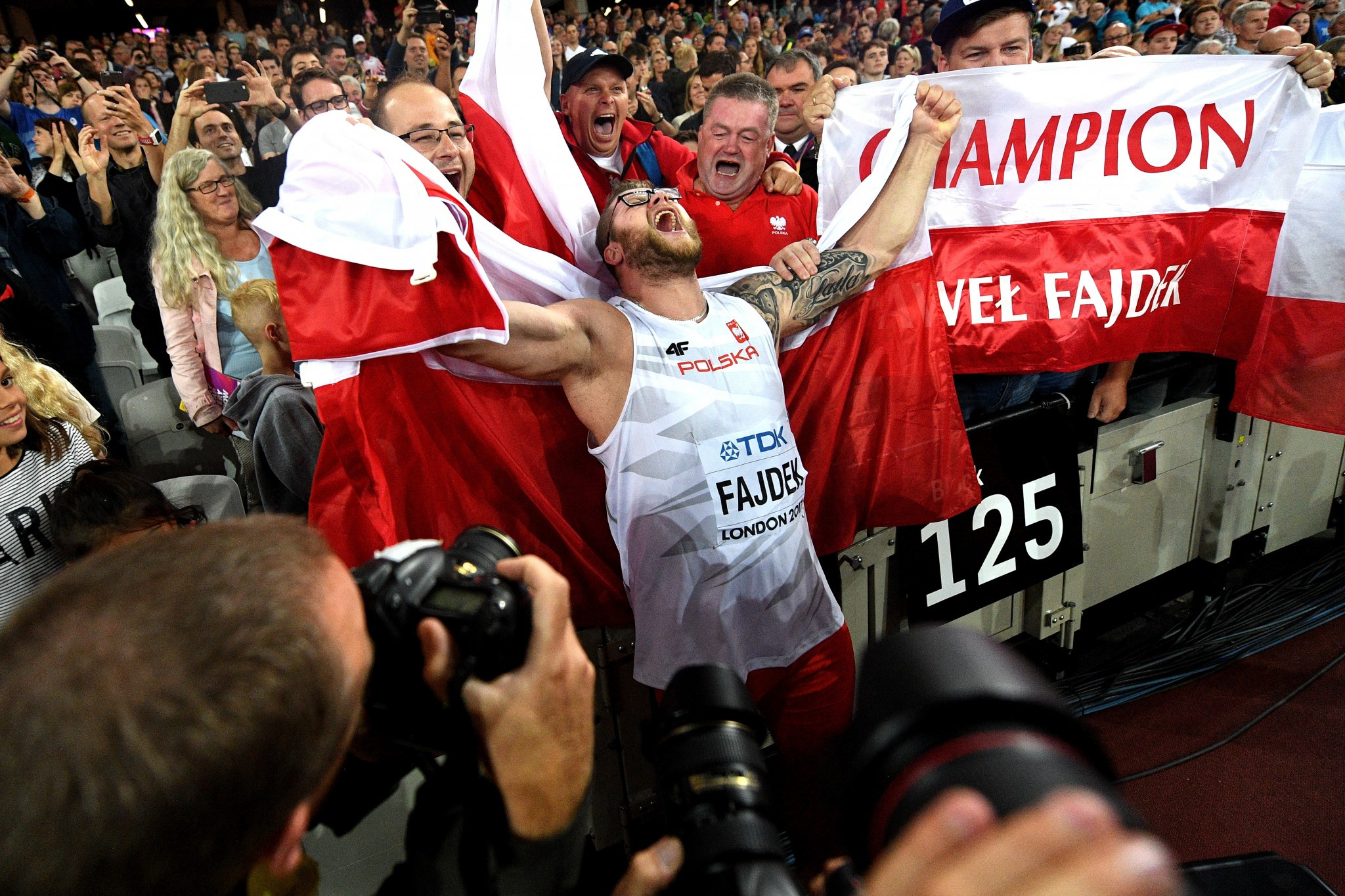 Pawel Fajdek celebrates his hammer victory with Polish supporters ©Getty Images
