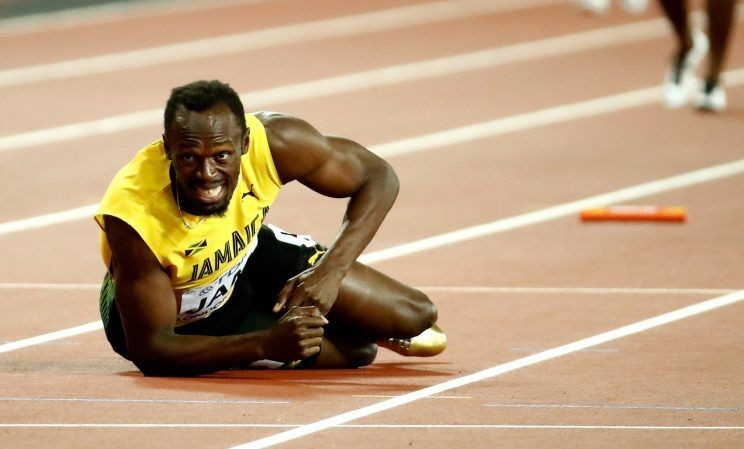 Usain Bolt pulled up injured as Britain won the 4x100m relay title ©Getty Images