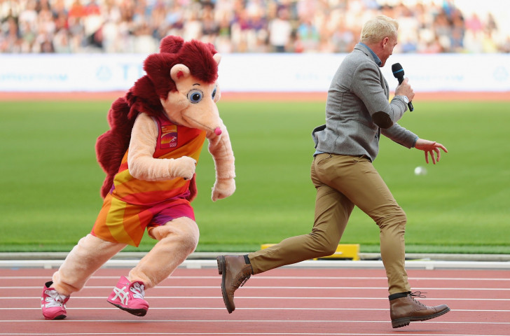 Hero makes one of his habitual violent moves during the IAAF World Championships in London on infield MC Iwan Thomas, playing Cato to the former athlete's Inspector Clouseau....©Getty Images