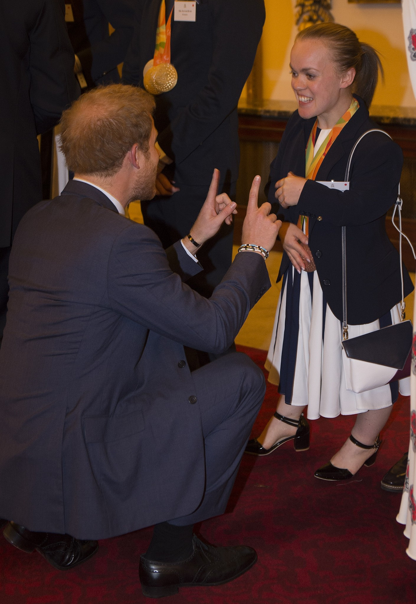 Ellie Simmonds chats with Prince Harry at a Buckingham Palace reception for Britain's Olympic and Paralympic teams from the Rio Games ©Getty Images