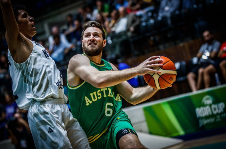 Mitchell Norton of Australia resists a New Zealand challenge during his side's 106-79 win in the FIBA Asia Cup semi-final in Lebanon ©FIBA