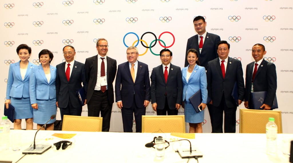 Beijing's bid team poses with IOC President Thomas Bach following the host city announcement ©Getty Images