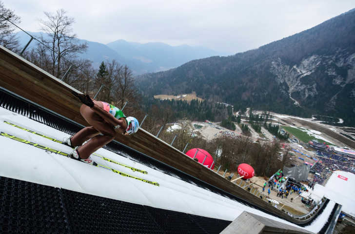 Poland's Kamil Stoch competes during the FIS Ski Jumping World Cup flying hill individual men's competition in March this year at Planica. Snow? No. ©Getty Images 