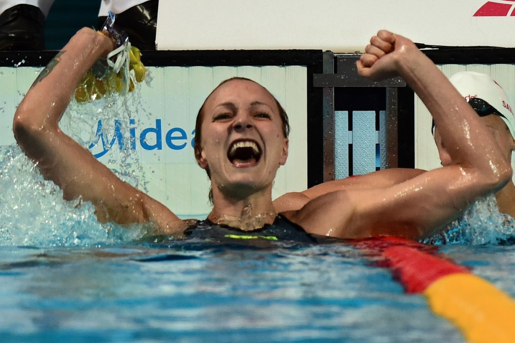 Sweden's Sarah Sjostrom celebrates breaking the women's 100m butterfly world record